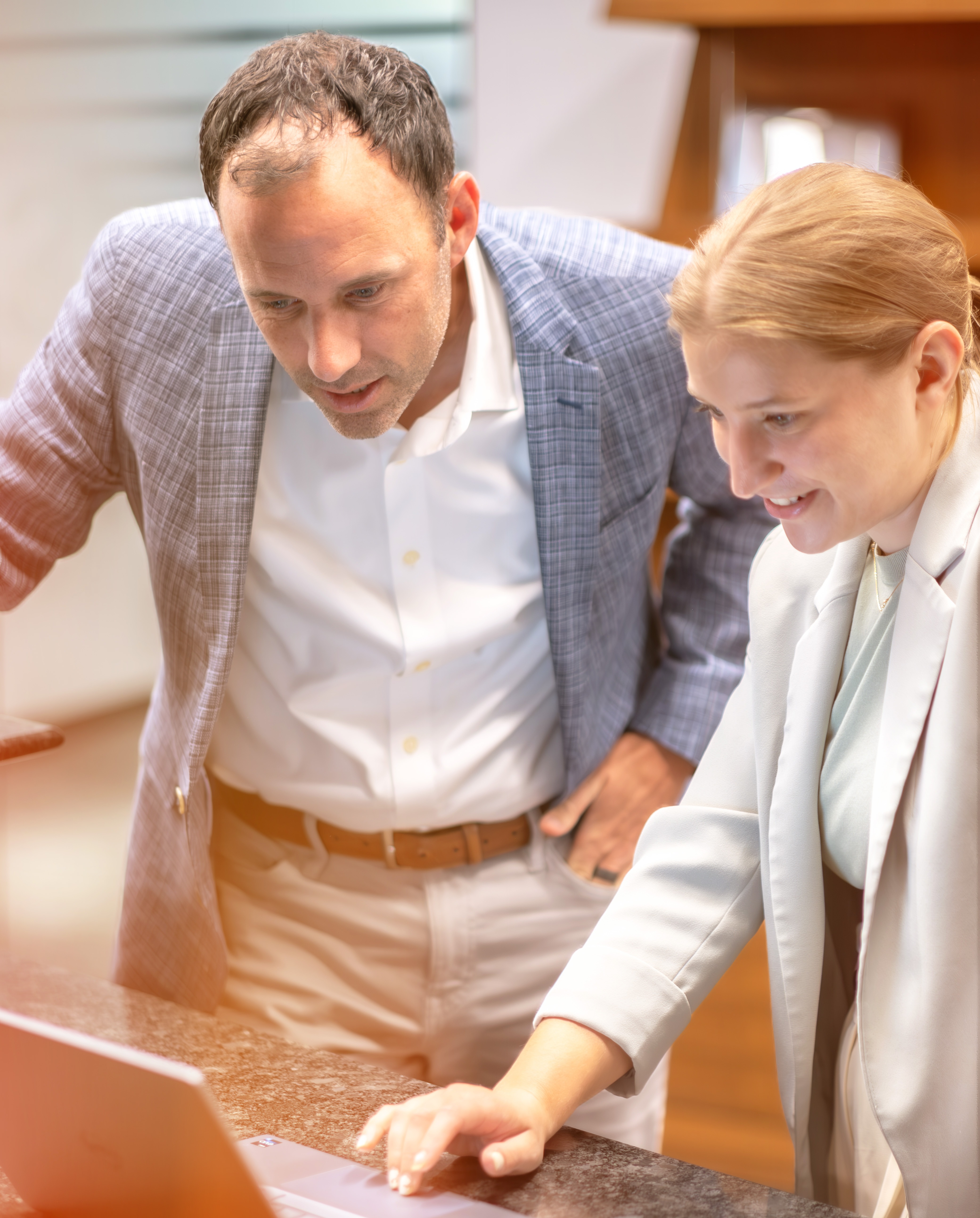 Man and Women Working Together on Computer